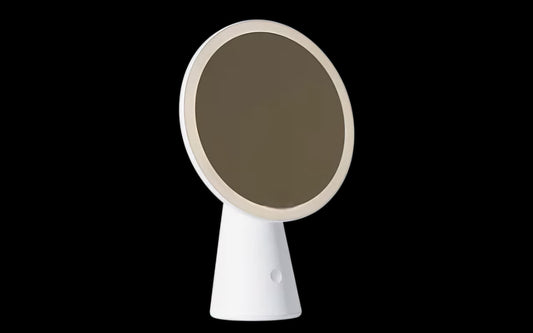 Stylish simple handheld vanity mirror with a round reflective surface, ideal for touch-ups and on-the-go beauty.